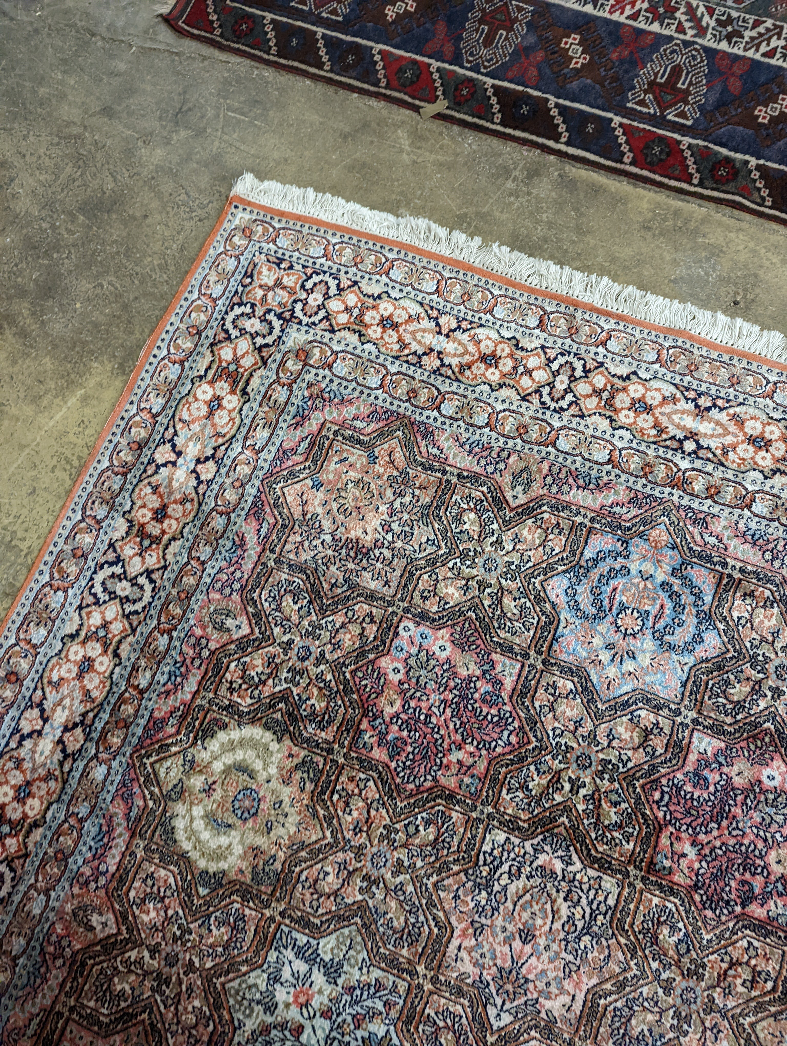 Two Turkish rugs and a Persian rugs. Largest, 284x172cm.